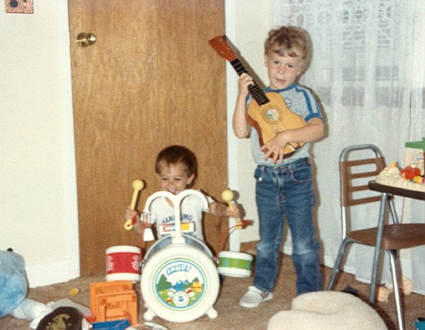 carrozzo brothers playing toy instruments as children